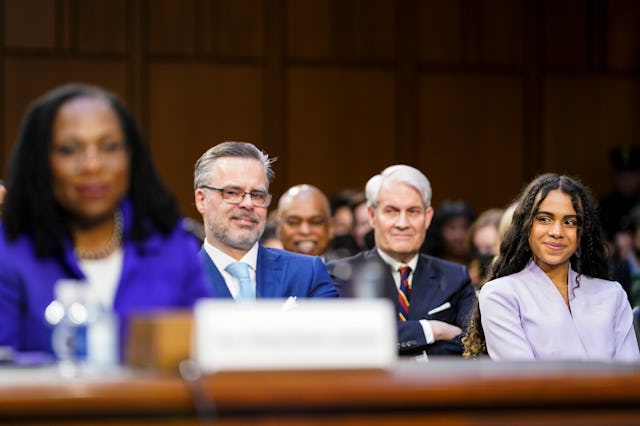 Judge Ketanji Brown Jacksons daughter Leila Jackson, right, and husband Dr. Patrick Jackson, left, l...