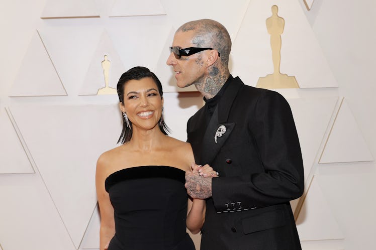 Kourtney Kardashian and Travis Barker on the 2022 Oscars red carpet on March 27, 2022 in Hollywood, ...