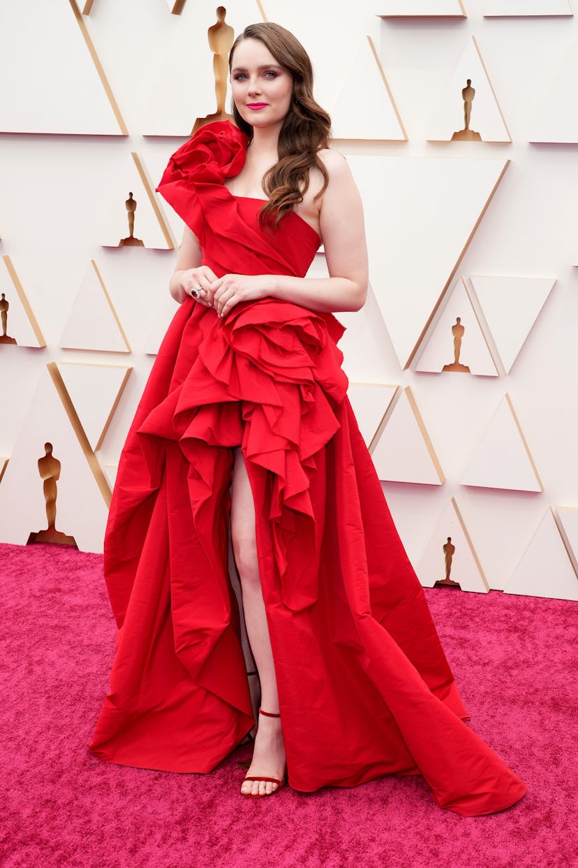 The 2022 Oscars red carpet was full of celebrities in red outfits. Here, Amy Forsyth. 