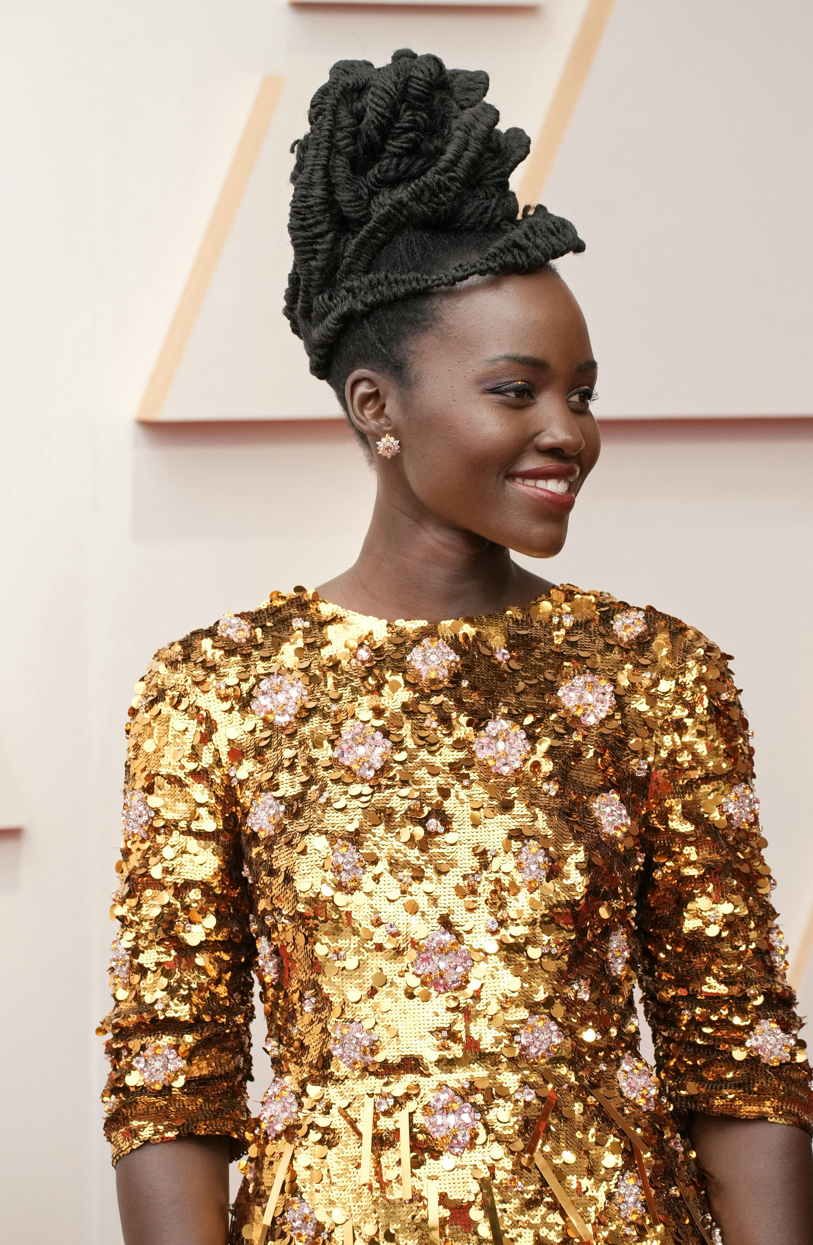 Lupita Nyong'o and other stars wearing sequins at the 2022 Oscars.