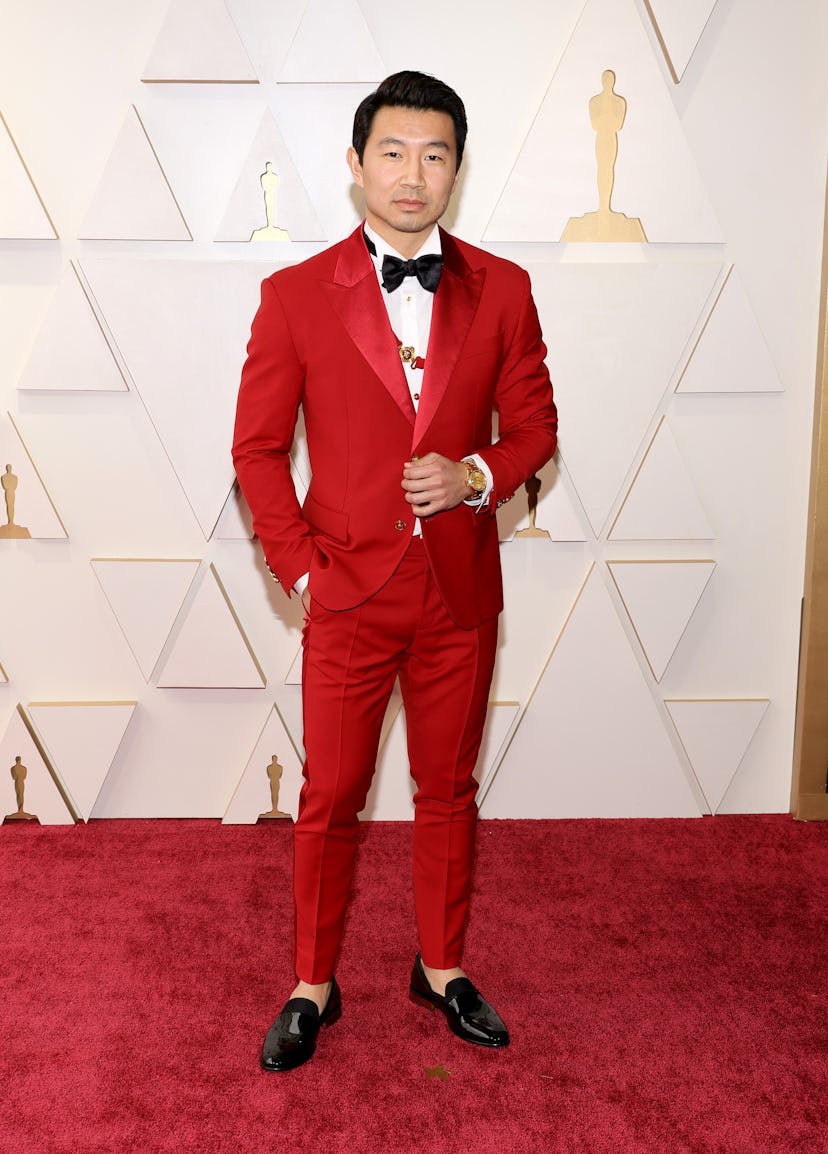 The 2022 Oscars red carpet was full of celebrities in red outfits. Here, Simu Liu.