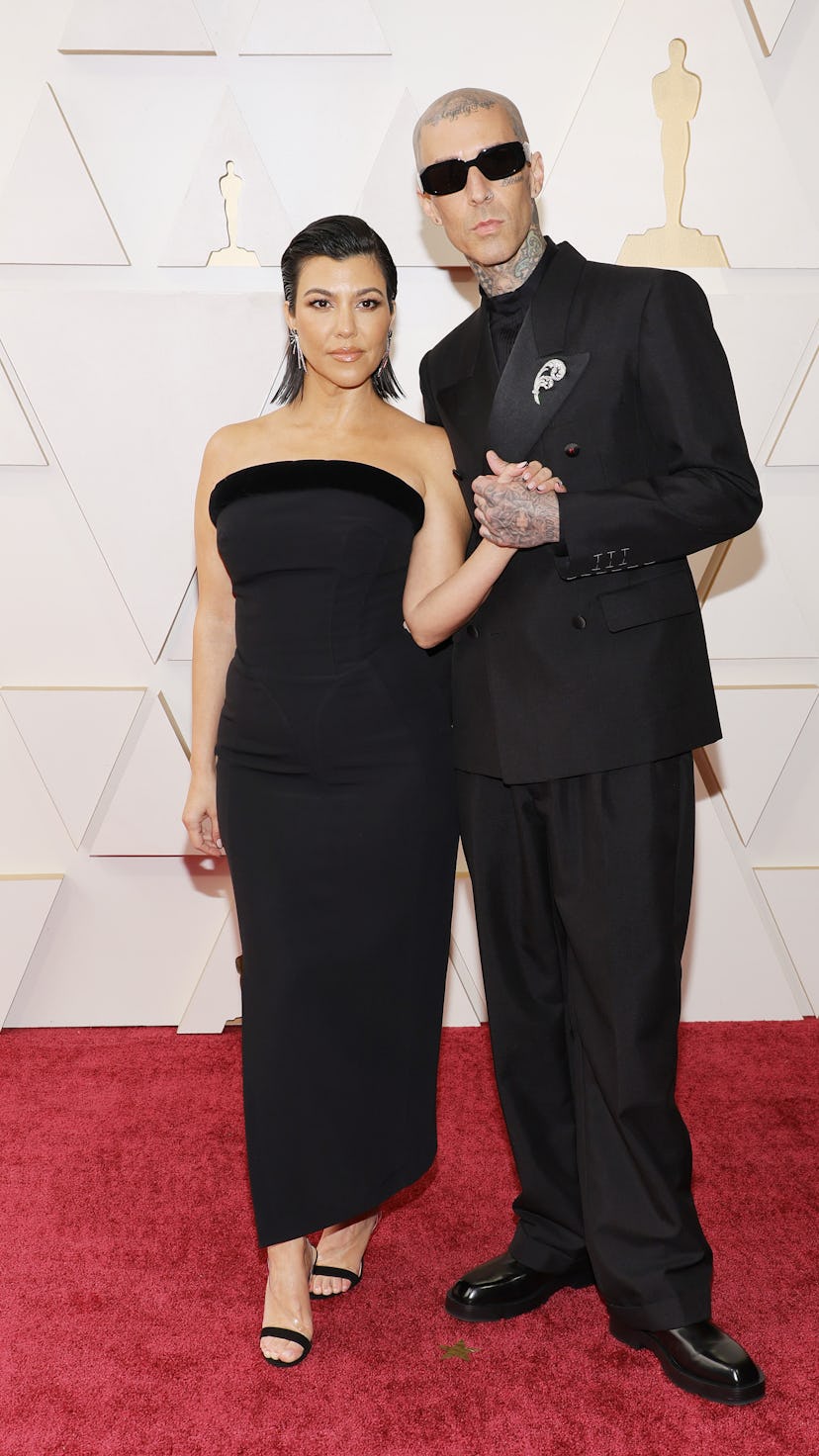 HOLLYWOOD, CALIFORNIA - MARCH 27: (L-R) Kourtney Kardashian and Travis Barker attend the 94th Annual...
