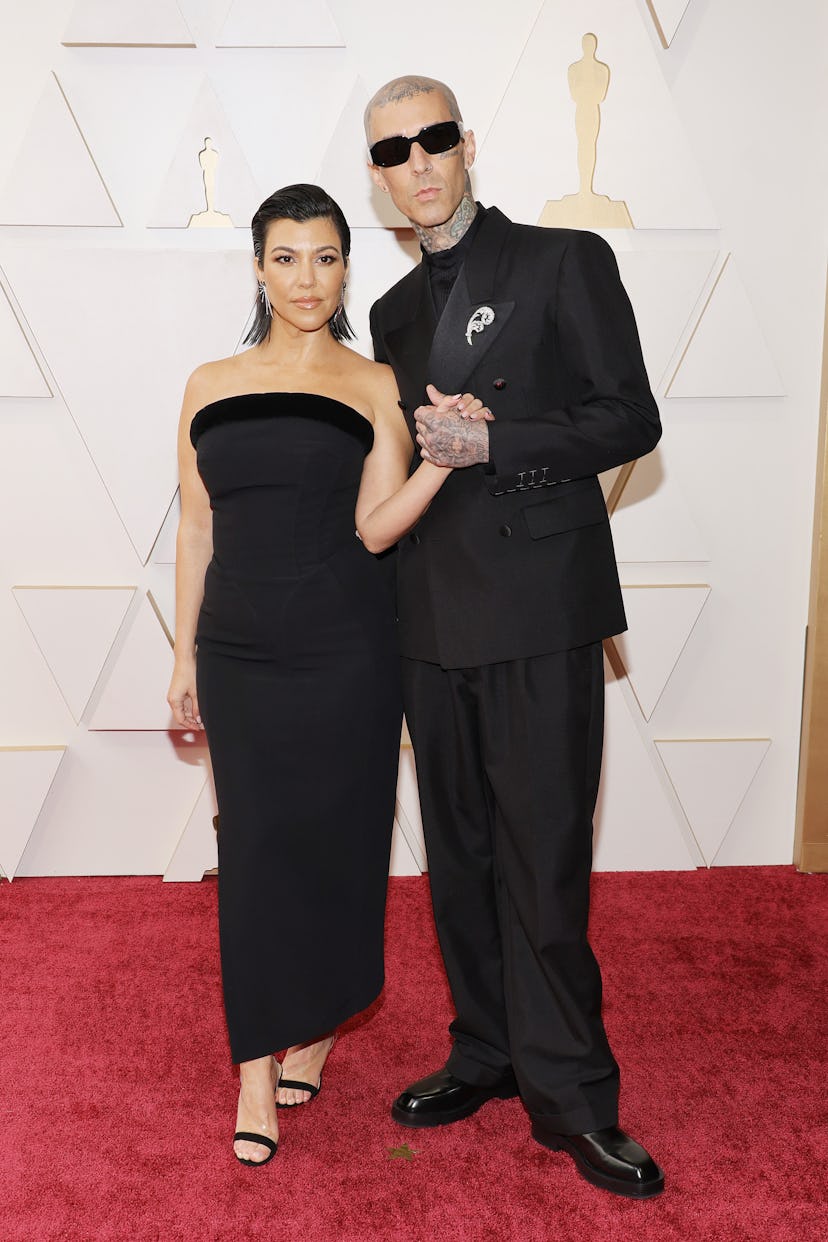 HOLLYWOOD, CALIFORNIA - MARCH 27: (L-R) Kourtney Kardashian and Travis Barker attend the 94th Annual...