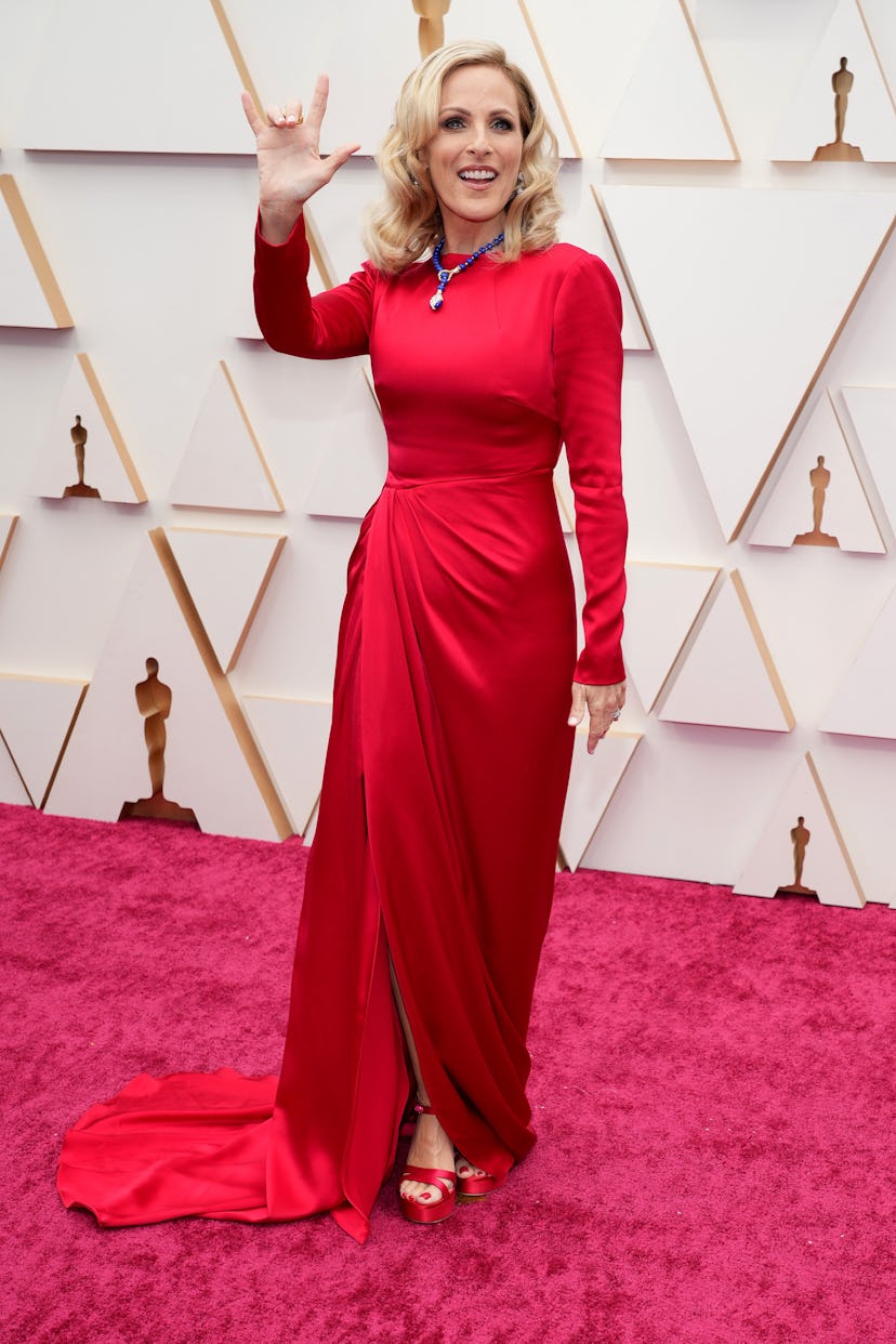 The 2022 Oscars red carpet was full of celebrities in red outfits. Here, Marlee Matlin. 