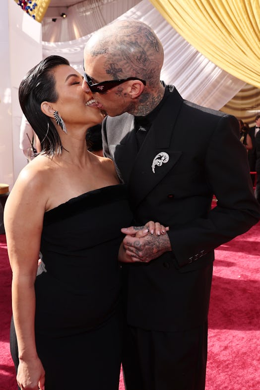 Kourtney Kardashian and Travis Barker shared a classic Kravis PDA moment on the 2022 Oscars red carp...