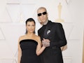 Kourtney Kardashian and Travis Barker shared a classic Kravis PDA moment on the 2022 Oscars red carp...
