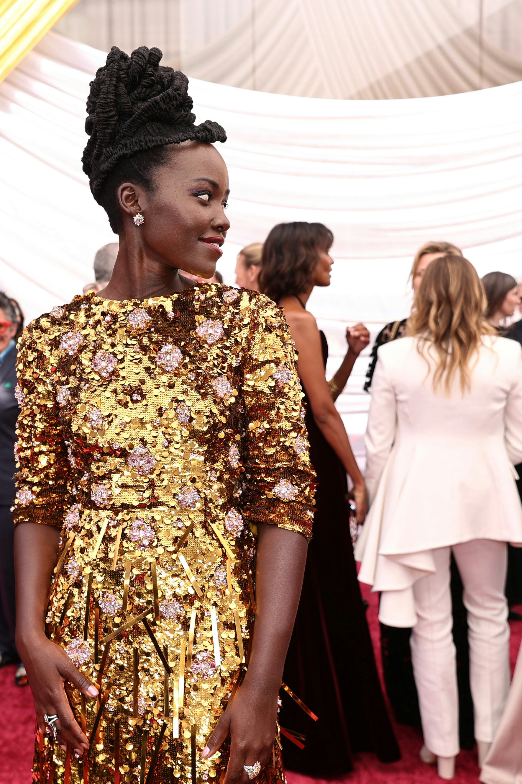 Lupita Nyong'o had the most relatable reaction to the apparent fight between Will Smith and Chris Ro...