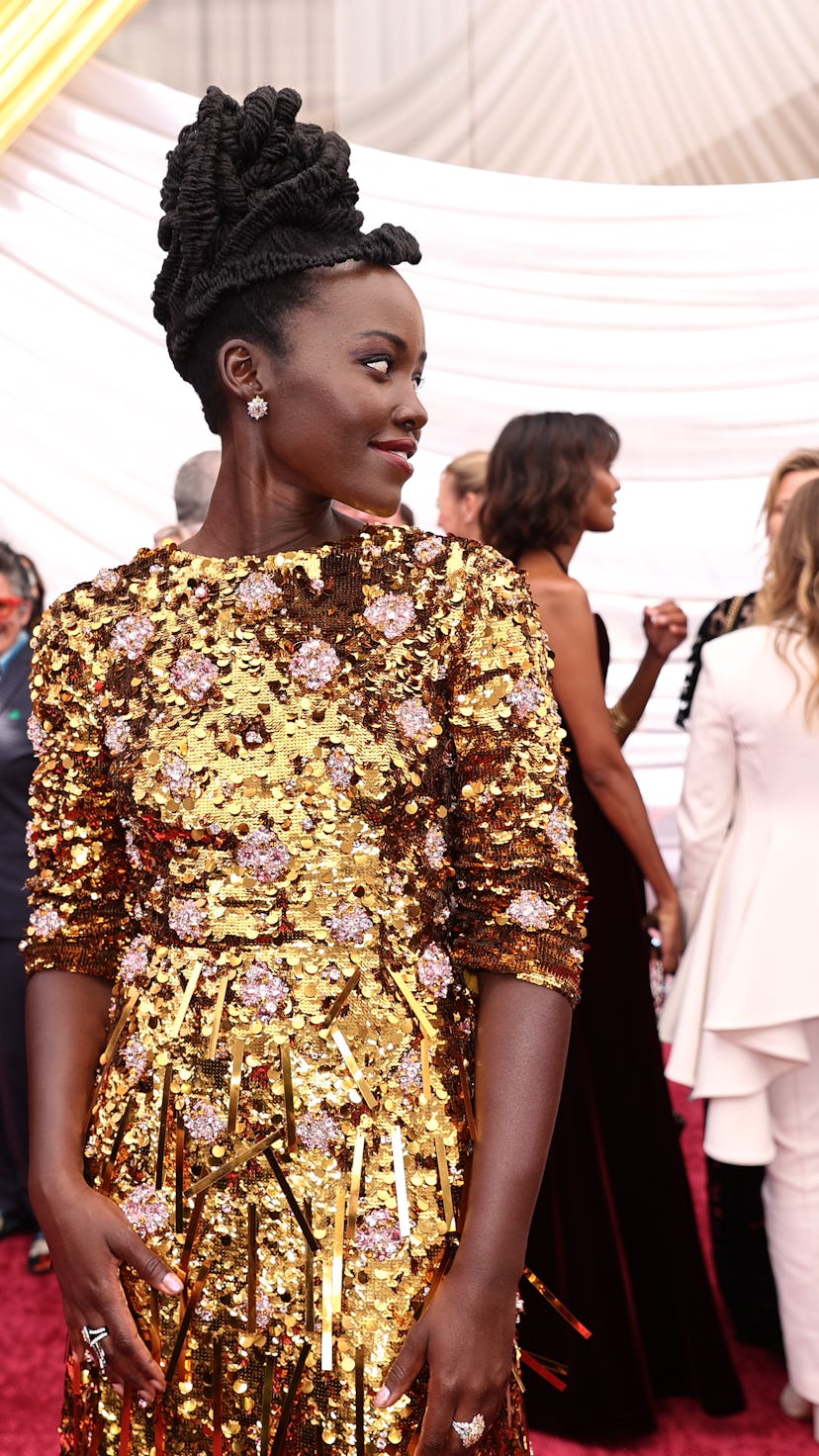 Lupita Nyong'o had the most relatable reaction to the apparent fight between Will Smith and Chris Ro...