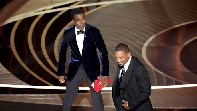 HOLLYWOOD, CA - March 27, 2022.    Chris Rock and Will Smith onstage during the show  at the 94th Ac...