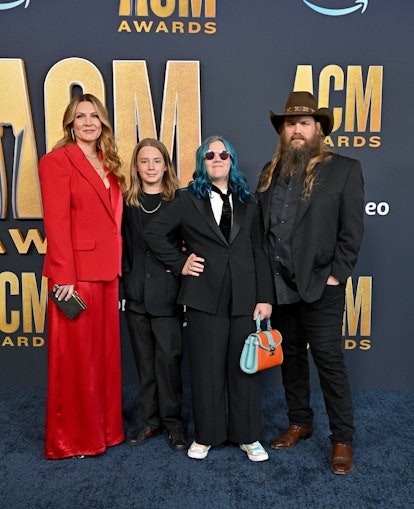 Chris Stapleton poses with his wife, Morgane, and their oldest kids, Waylon and Ada.