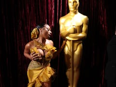 Megan Thee Stallion poses at the 2022 Oscars.