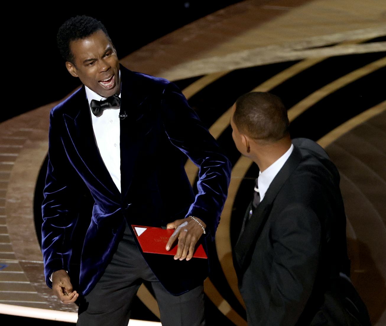 HOLLYWOOD, CALIFORNIA - MARCH 27: (L-R) Chris Rock and Will Smith are seen onstage during the 94th A...