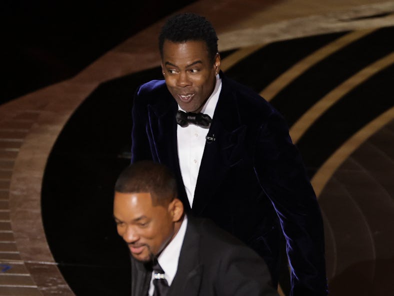 HOLLYWOOD, CALIFORNIA - MARCH 27: (L-R) Will Smith and Chris Rock are seen onstage during the 94th A...