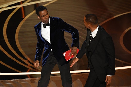 US actor Will Smith (R) slaps US actor Chris Rock onstage during the 94th Oscars at the Dolby Theatr...