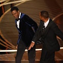 TOPSHOT - US actor Will Smith (R) slaps US actor Chris Rock onstage during the 94th Oscars at the Do...