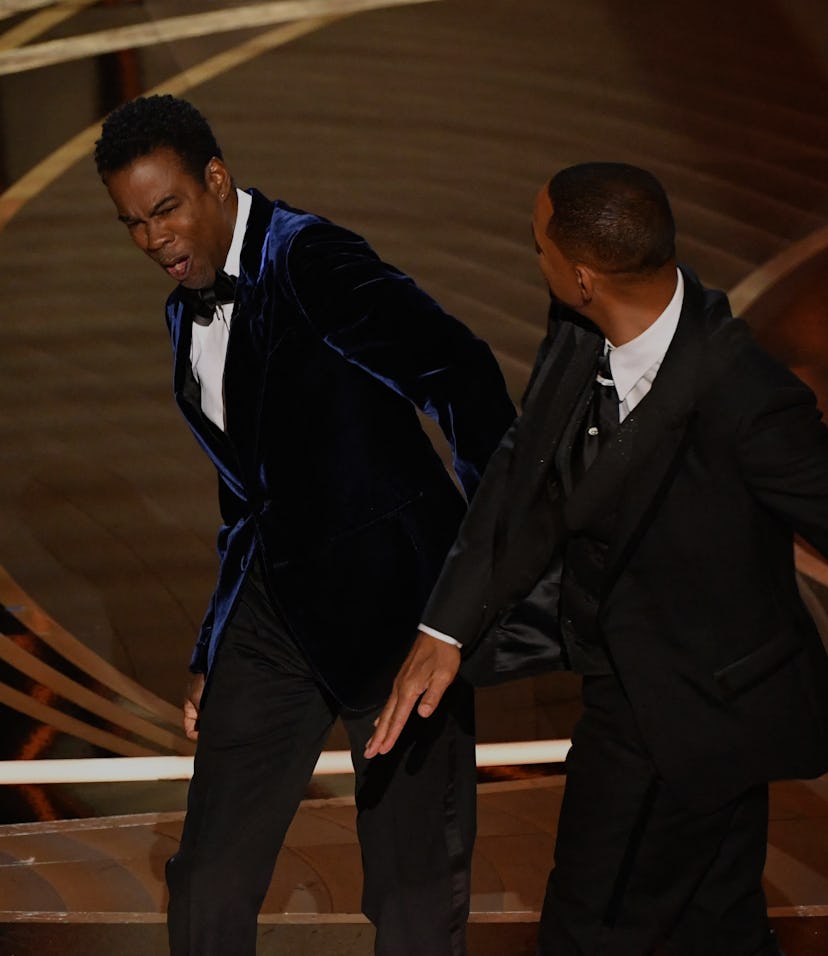 TOPSHOT - US actor Will Smith (R) slaps US actor Chris Rock onstage during the 94th Oscars at the Do...