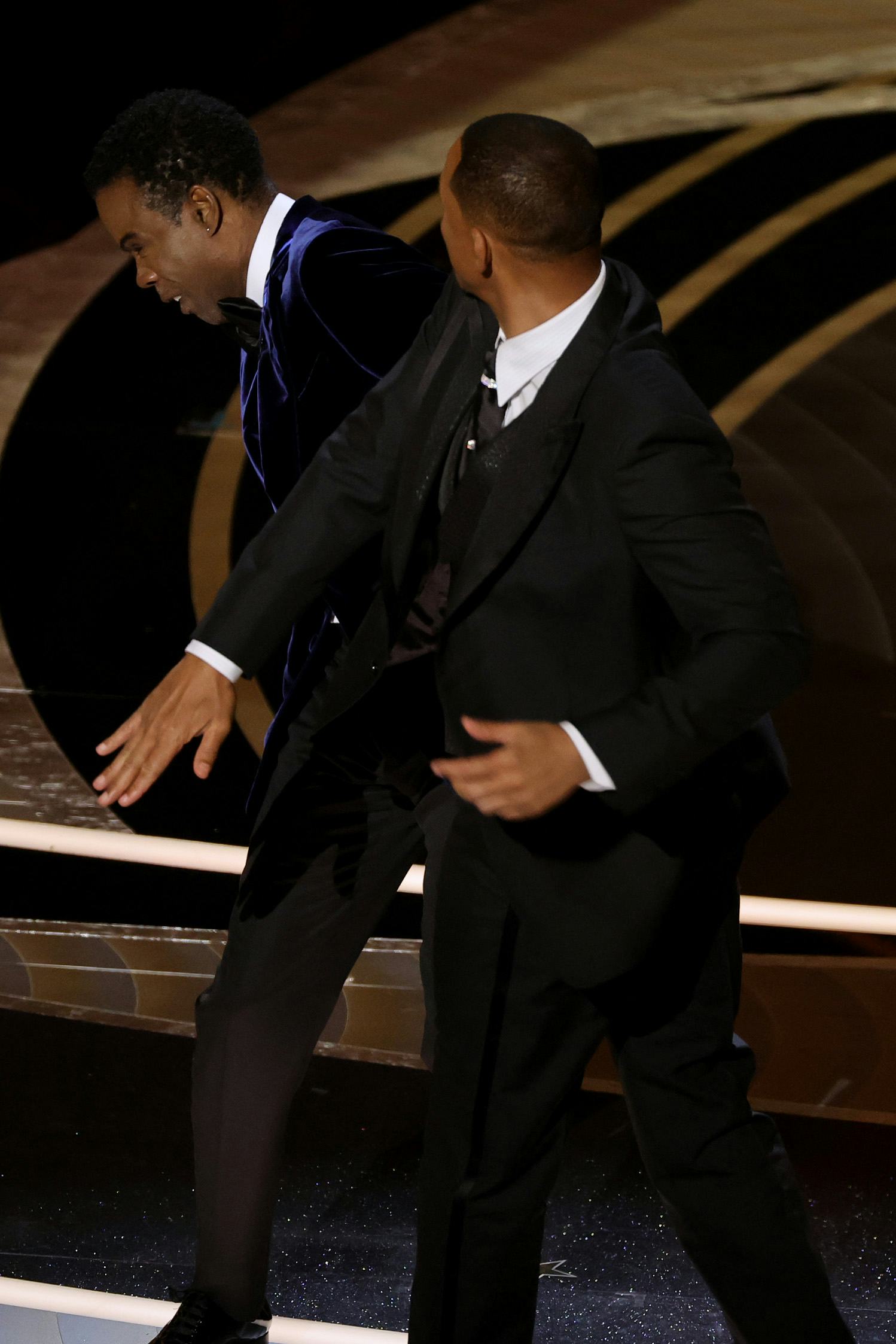 HOLLYWOOD, CALIFORNIA - MARCH 27: Will Smith appears to slap Chris Rock onstage during the 94th Annu...