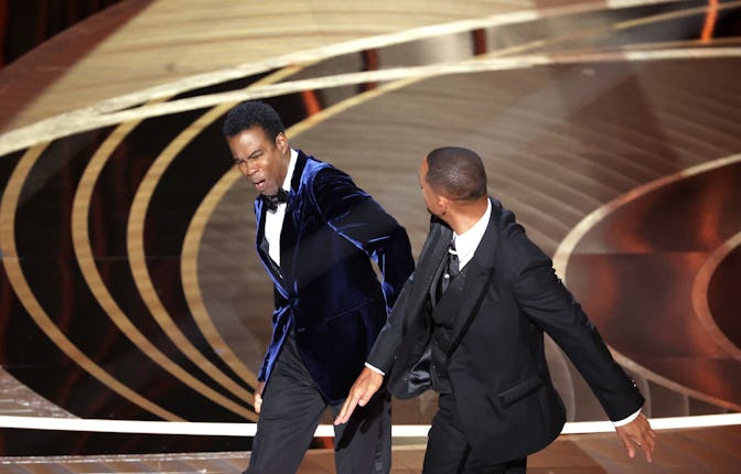 HOLLYWOOD, CA - March 27, 2022. Will Smith slaps Chris Rock onstage during the show at the 94th ...