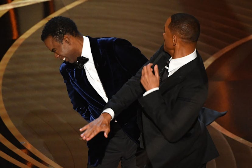 TOPSHOT - US actor Will Smith (R) slaps US actor Chris Rock onstage during the 94th Oscars at the Do...