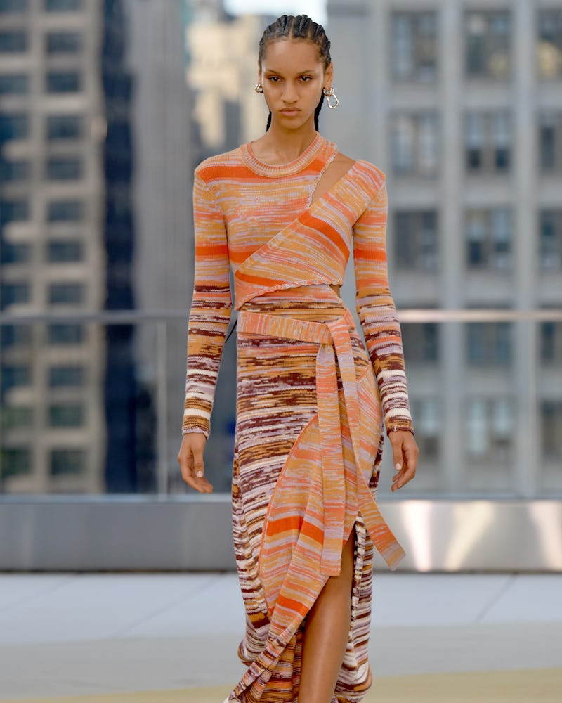 a model wearing a knit maxi dress on the Jonathan Simkhai Spring/Summer 2022 runway