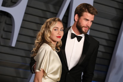 BEVERLY HILLS, CALIFORNIA - MARCH 04: Miley Cyrus and Liam Hemsworth attend the 2018 Vanity Fair Osc...