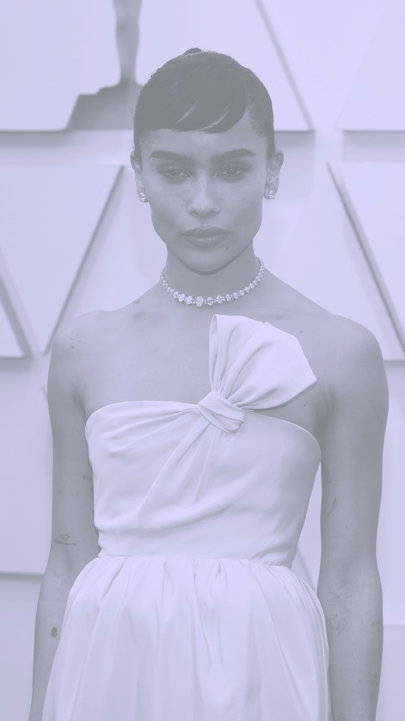 Zoë Kravitz attends the 2022 Oscars red carpet wearing pastel pink.