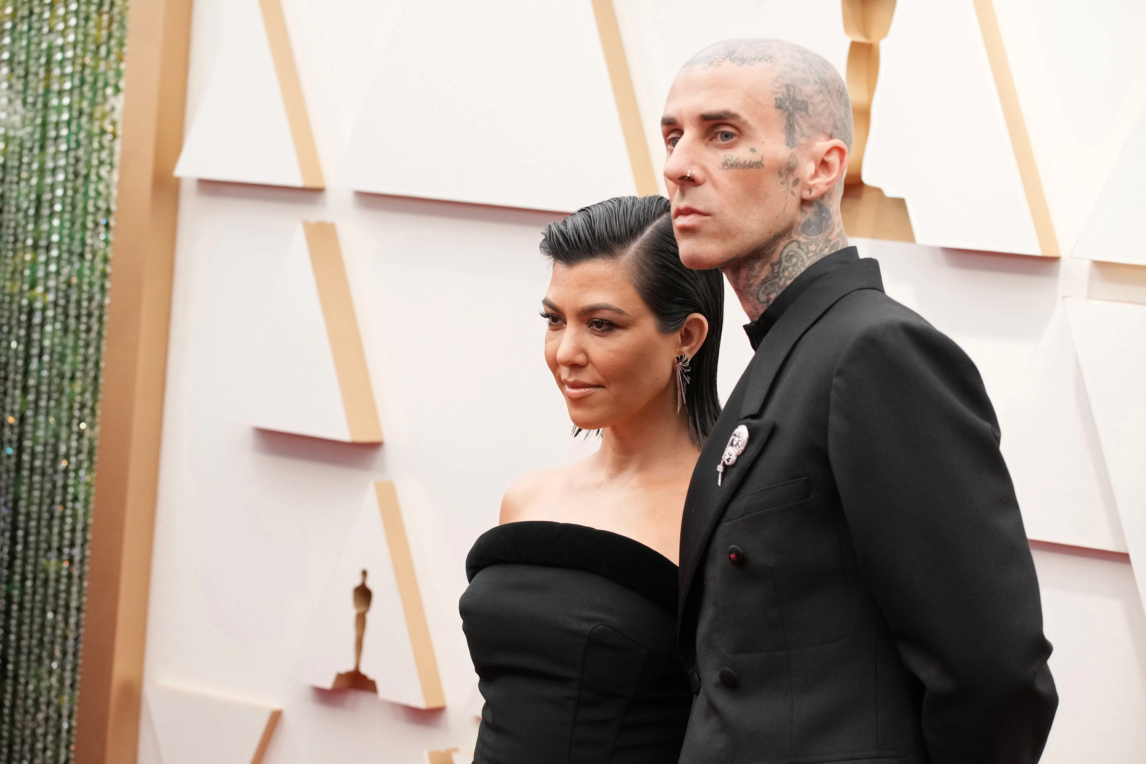 HOLLYWOOD, CALIFORNIA - MARCH 27: (L-R) Kourtney Kardashian and Travis Barker attend the 94th Annual...