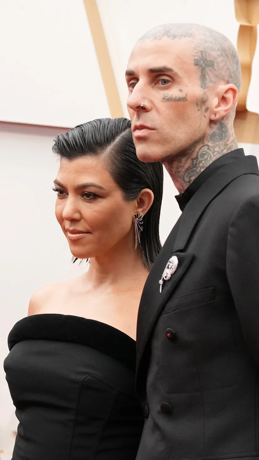 HOLLYWOOD, CALIFORNIA - MARCH 27: (L-R) Kourtney Kardashian and Travis Barker attend the 94th Annual...