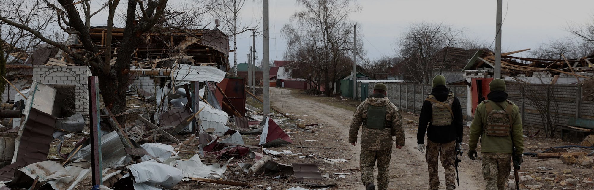 Ukrainian soldiers patrol in a village on the frontline of the northern part of Kyiv region on March...