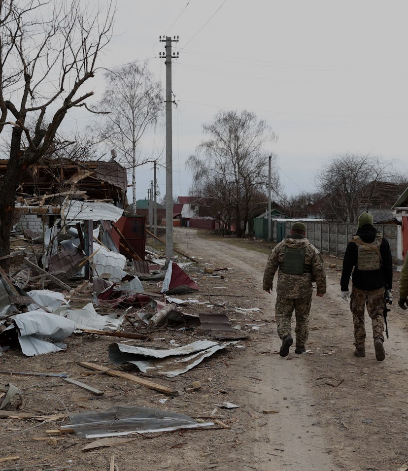 Ukrainian soldiers patrol in a village on the frontline of the northern part of Kyiv region on March...