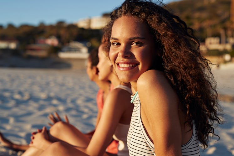 A woman at the beach for spring break will need a sun caption.