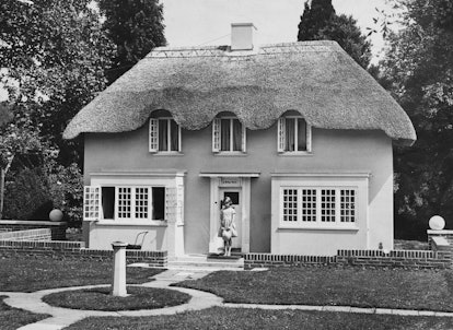 Princess Elizabeth stands in the doorway of Y Bwthyn Bach ('The Little Cottage' in Welsh), situated ...