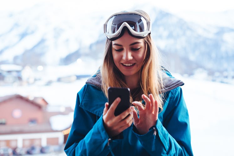 A woman on spring break at a ski resort uses clever captions for spring break for her Instagram post...