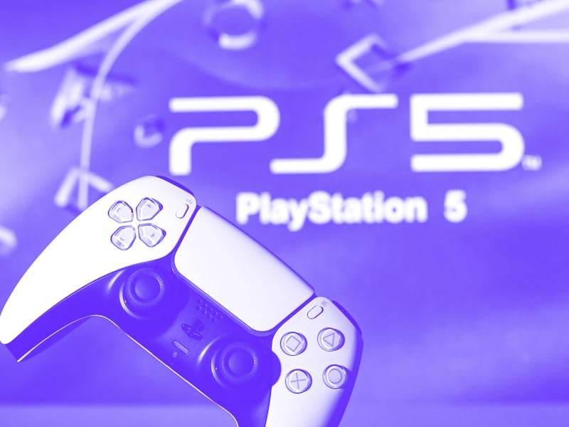 SPAIN - 2021/11/08: In this photo illustration, a PlayStation 5 controller seen with a PlayStation 5...