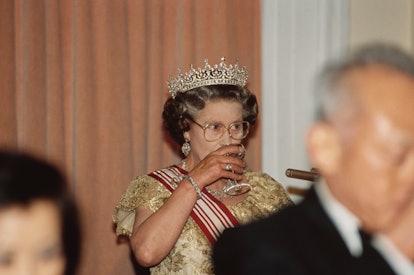 British Royal Queen Elizabeth II, wearing the Girls of Great Britain and Ireland diamond tiara, atte...