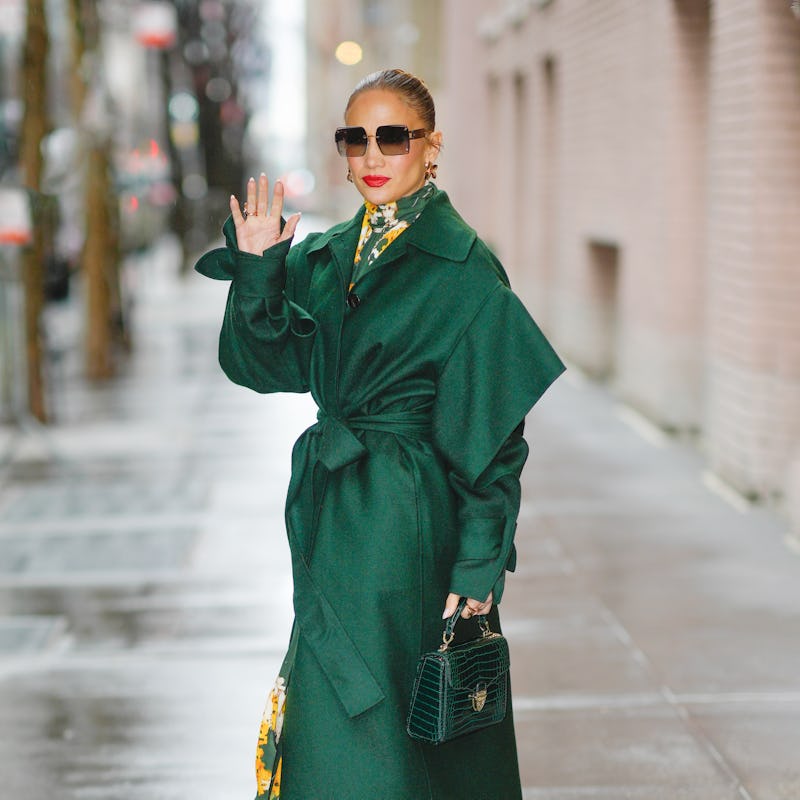 Jennifer Lopez wears floral print dress and green coat from Del Core.