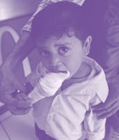 A Child eating ice cream at a McDonalds outlet, India. (Photo by: Salman Quraishi/IndiaPictures/Univ...