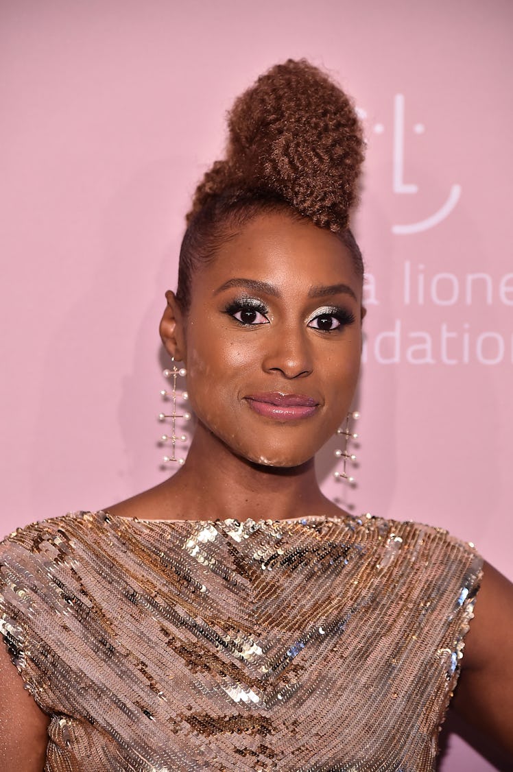 Issa Rae in gold eyeshadow and dramatic lashes to Rihanna's 4th Annual Diamond Ball.