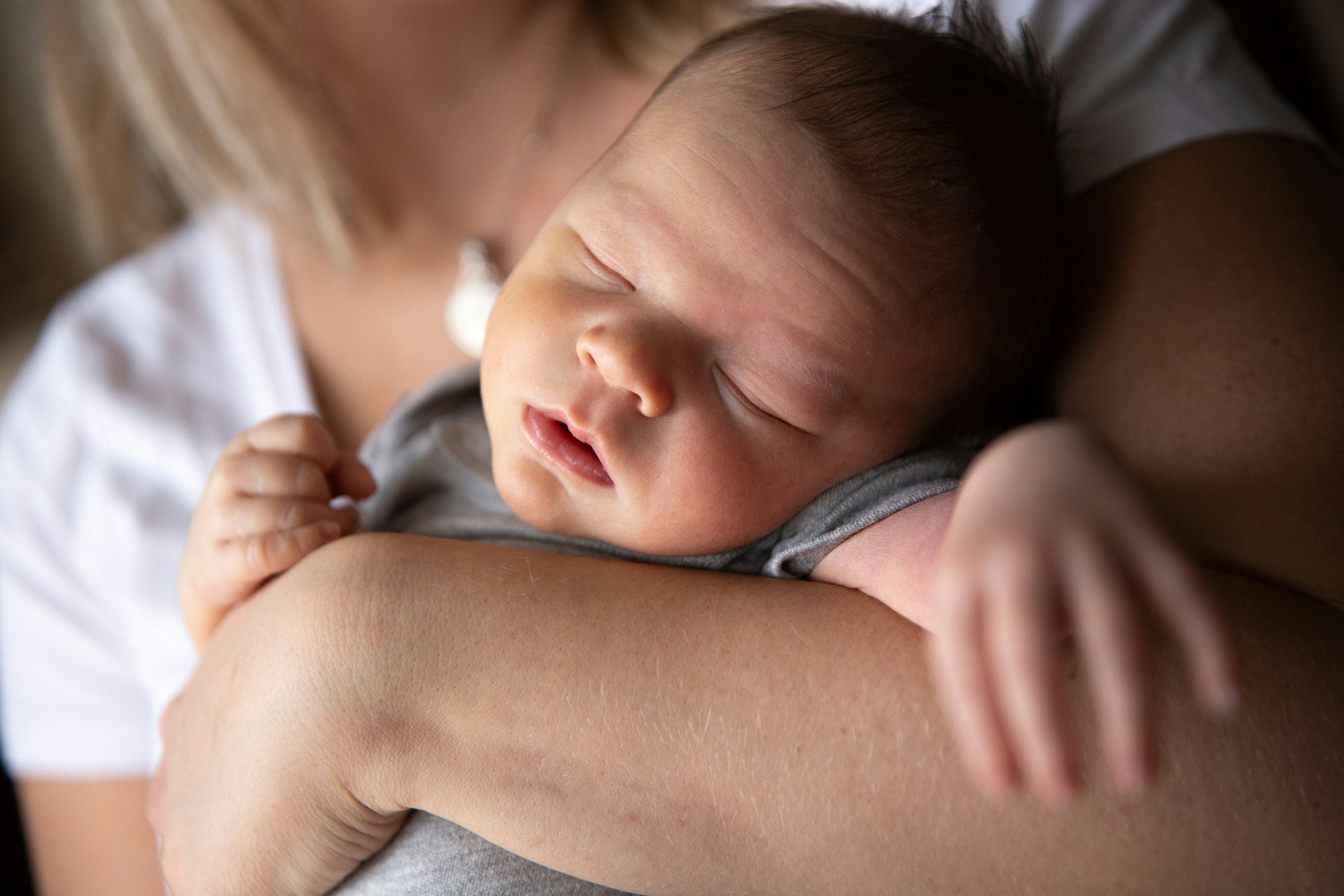 Why Is My Baby Fighting Sleep? Experts Explain Why & What To Do