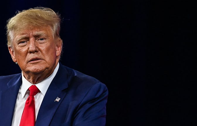 Donald Trump sitting down at at the Conservative Political Action Conference 2022