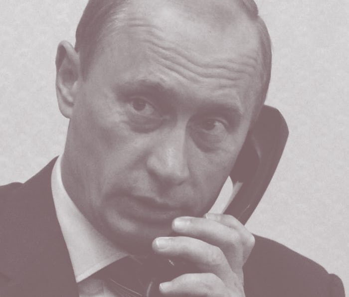 Russian President Vladimir Putin speaks on the telephone in his office at the Novo-Ogaryovo Presiden...