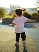 Mom letting child play at the playground