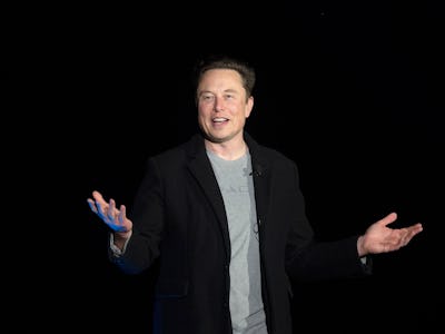 Elon Musk gestures as he speaks during a press conference at SpaceX's Starbase facility near Boca Ch...