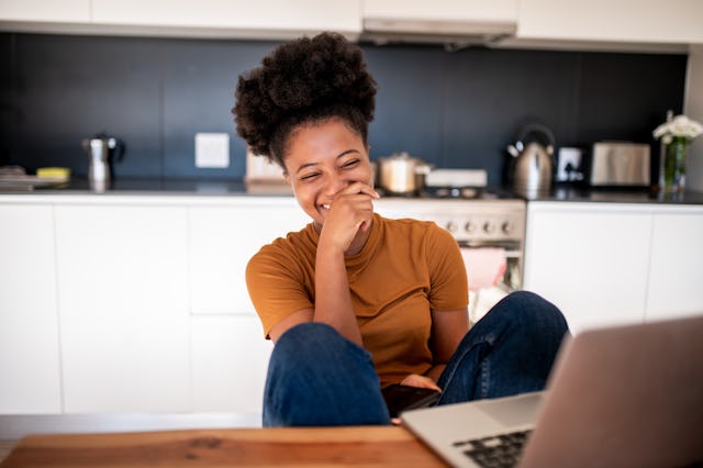 Young woman watching her favorite comedian show