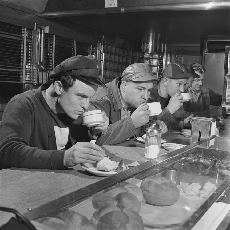 Working men drinking coffee at a diner, USA, circa 1955.  (Photo by Archive Photos/Getty Images)