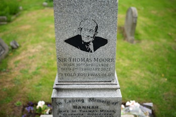 KEIGHLEY, ENGLAND - AUGUST 16: A portrait of Sir Tom Moore adorns the headstone of the family grave ...