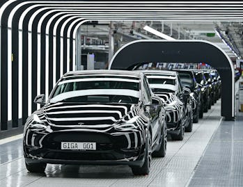 A line of electric vehicles of the model Y is pictured during the start of the production at Tesla's...