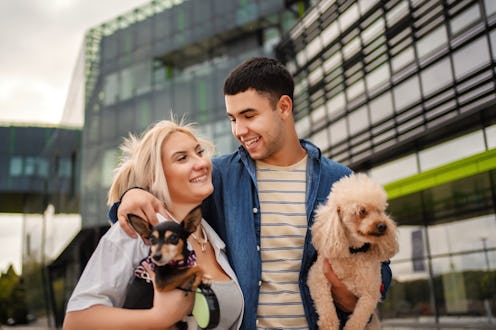 Young couple taking their dogs for a walk