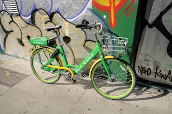 Lime-E electric bike leaning against a graffiti wall in Soho in London. (Photo by: Chris Harris/UCG/...