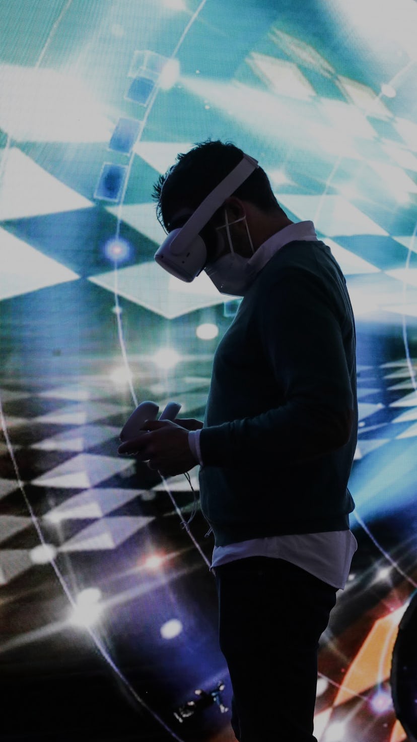 A man experiences the "Metaverse" via VR technology during the Mobile World Congress MWC in Barcelon...